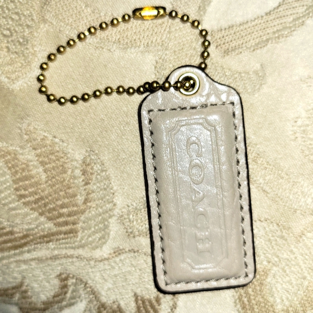Coach bag tag